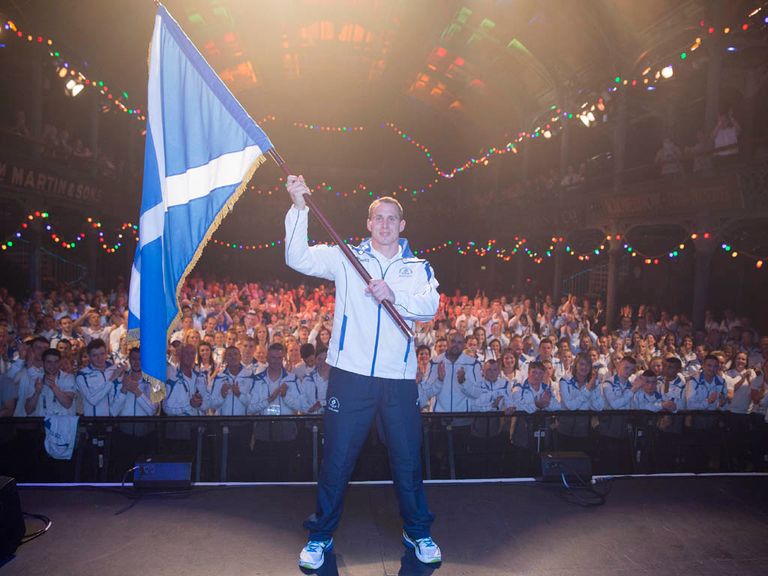Euan Burton proudly displays the Scottish flag