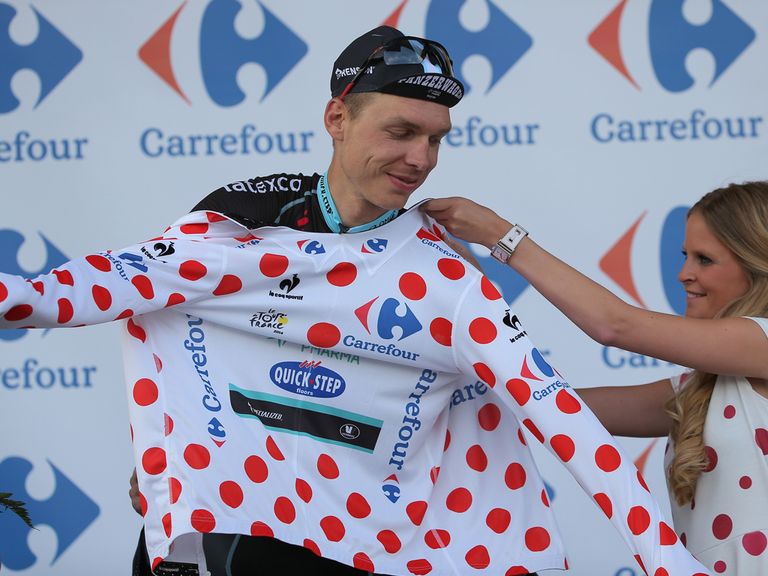 Tony Martin receives the polka dot jersey