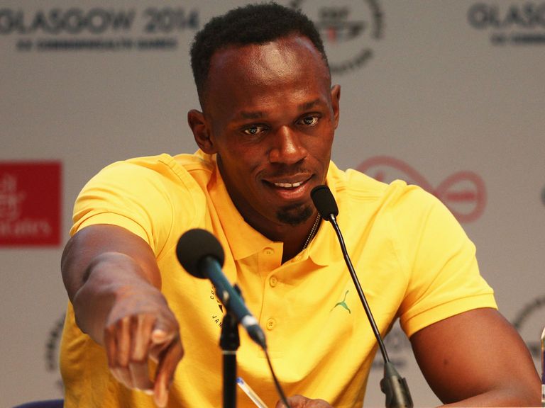Usain Bolt fields questions from the media after arriving in Glasgow