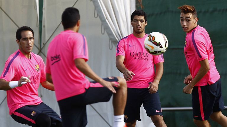Barcelona striker Luis Suarez trained with his new team-mates for the first time.