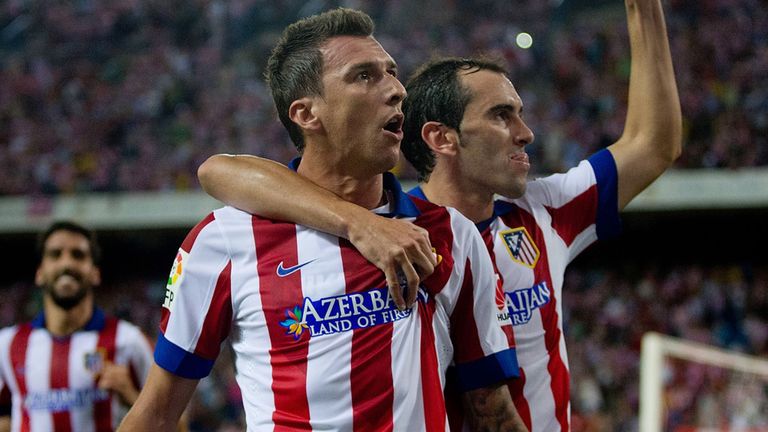 Mario Mandzukic (left) celebrates after scoring for Atletico