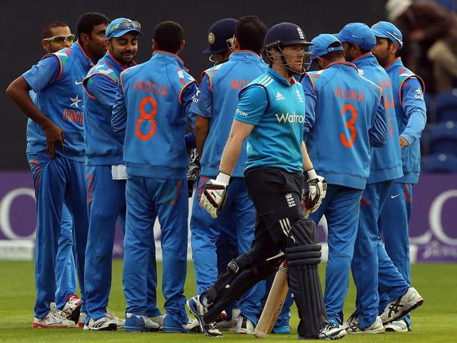 India celebrate as Eoin Morgan trudges off