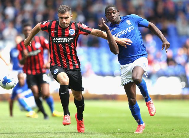 Clayton Donaldson of Birmingham City tangles with Aaron Hughes