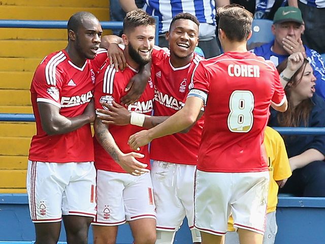 Henri Lansbury celebrates with team mates