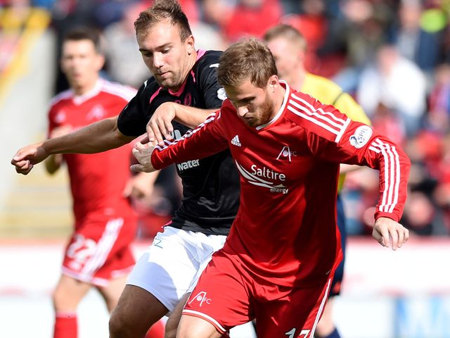 Aberdeen's David Goodwillie holds off Conrad Balatoni