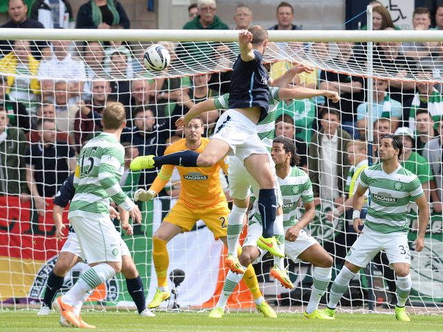 James McPake heads Dundee into the lead