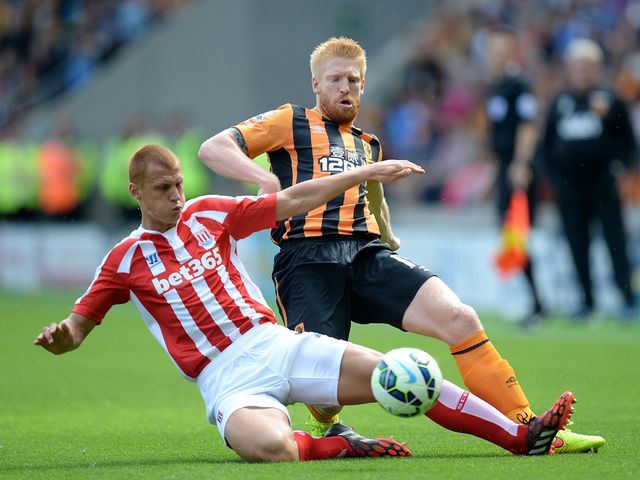 Paul McShane battles for the ball with Steve Sidwell