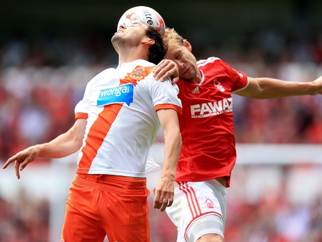 Blackpool's Sergei Zenjov and Daniel Harding battle for the ball