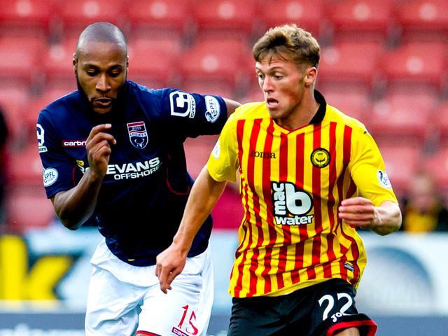 Ross County's Yoann Arquin chases down Partick's Gary Fraser