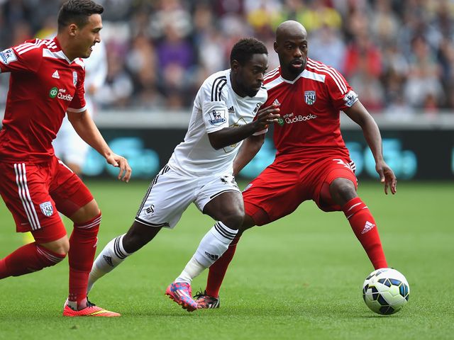 Swansea player Nathan Dyer races through the West Brom defence
