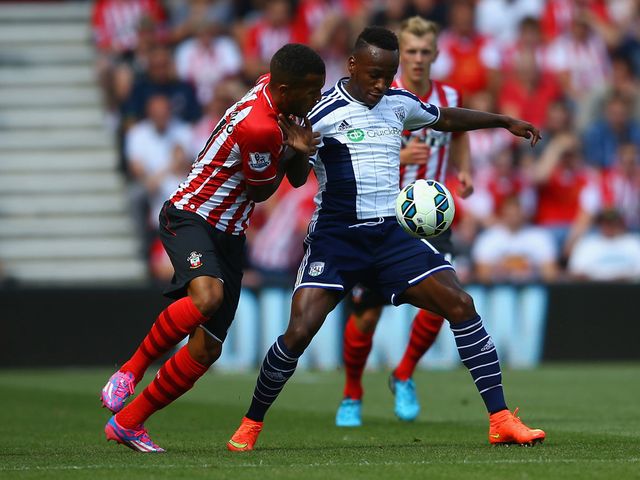 Saido Berahino holds off a challenge from Ryan Bertrand
