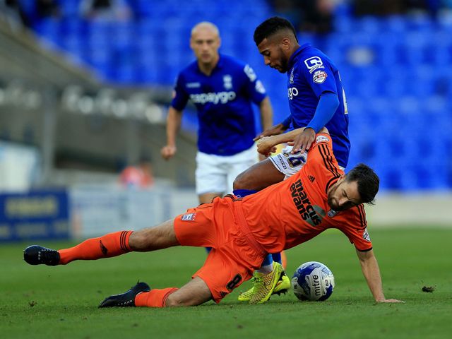 Birmingham City's David Davis challenges Ipswich Town's Cole Skuse