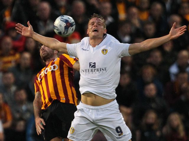 Leeds United's Billy Sharp battles with Alan Sheehan