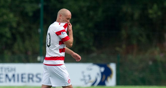 Hamilton player/manager Alex Neil leaves the field after defeat to Inverness