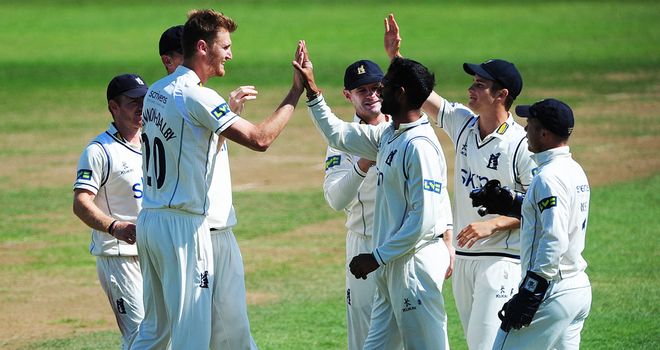 Oliver Hannon-Dalby is congratulated on taking a wicket