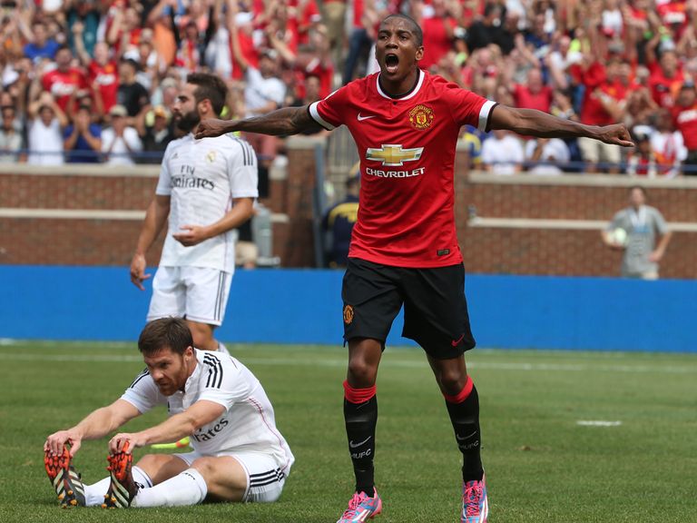 Ashley Young celebrates as he helps Manchester United to victory