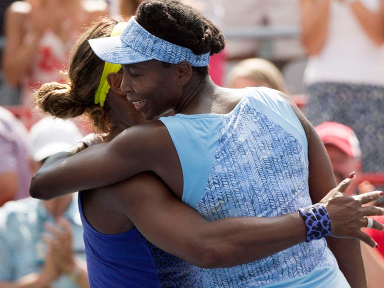 Venus Williams hugs her sister Serena after beating her at the Rogers Cup