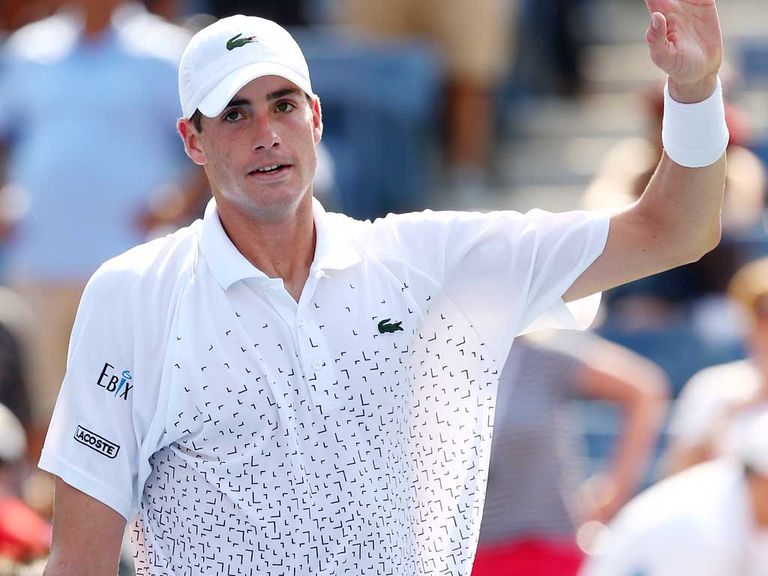 John Isner celebrates after defeating Marcos Giron