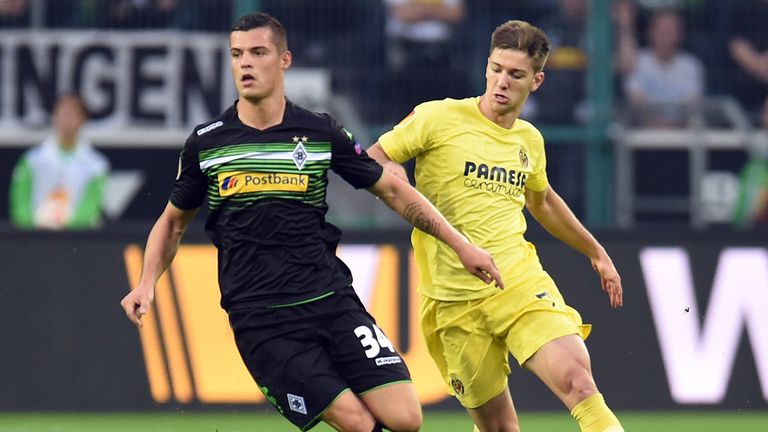 Swiss midfielder Granit Xhaka [left] and Villarreal's Luciano Vietto