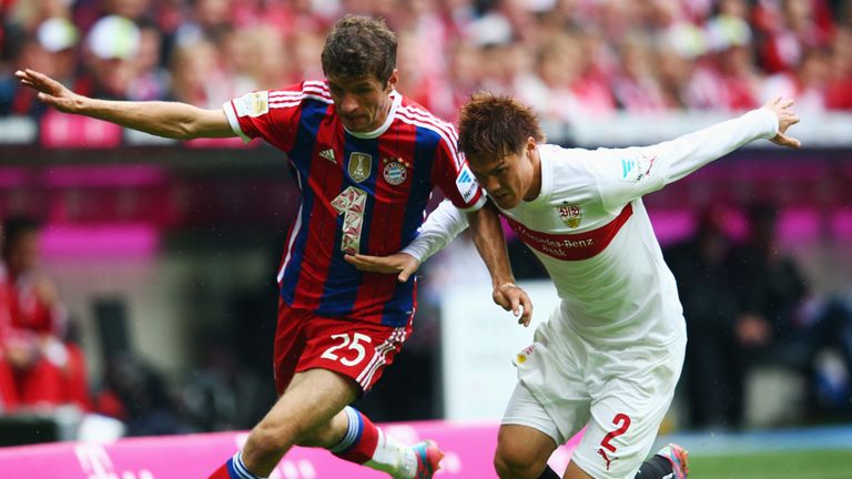 Thomas Muller takes on Gotoku Sakai