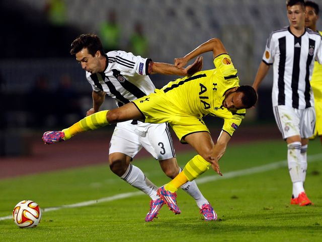 Partizan Belgrade's Vladimir Volkov fights for the ball with Andros Townsend
