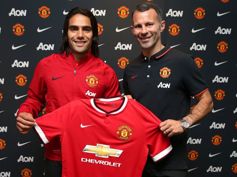 Manchester United striker Radamel Falcao is welcomed by Ryan Giggs