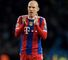 A dejected Arjen Robben of Bayern Muenchen applauds the travelling fans