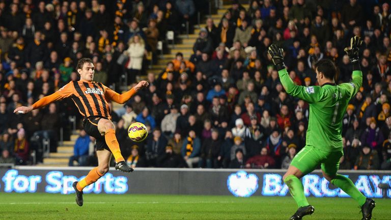 Nikica Jelavic lifts the ball over Everton's Joel Robles to score