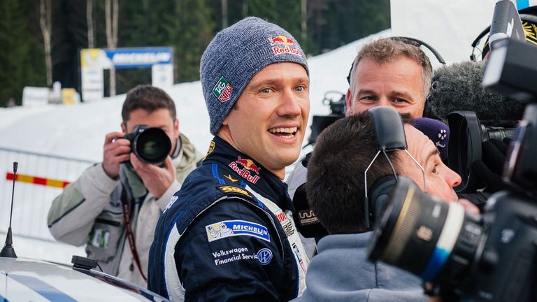 Sebastien Ogier of France (C) celebrates