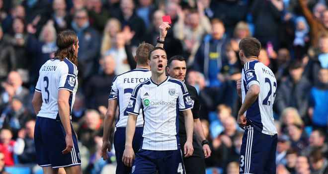 West Brom's Gareth McAuley is shown a red card after just two minutes against Manchester City.