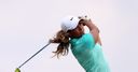 Woods leads after record round