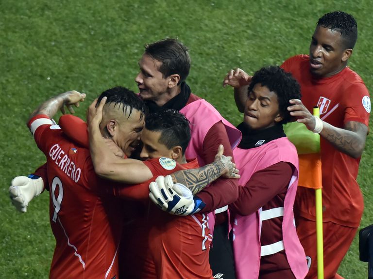 Peru's forward Paolo Guerrero celebrates with team-mates after scoring against Bolivia