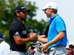 Jordan Spieth (right) will be defending his crown at the Australian Open against Jason Day