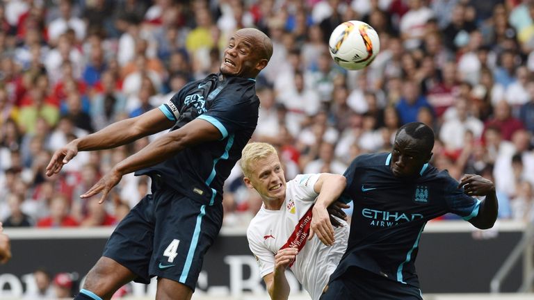 Timo Baumgartl vies for the ball with Vincent Kompany and Bacary Sagna