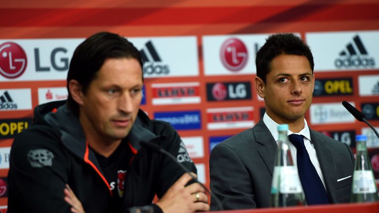 Javier Hernandez (right) and alongside Bayer Leverkusen head coach Roger Schmidt