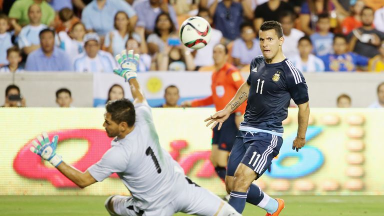 Argentina's Sergio Aguero chips Bolivia keeper Daniel Vaca.