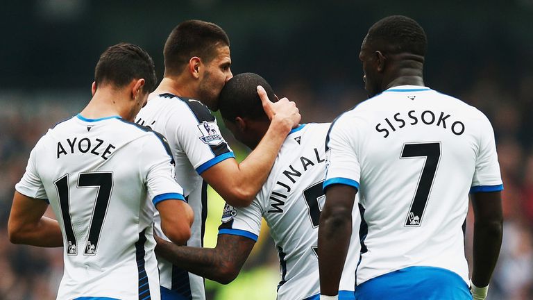 Aleksandar Mitrovic (second left) of Newcastle United celebrates scoring his team's opening goal 