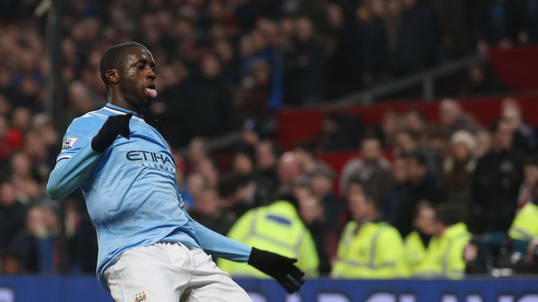 Yaya Toure of Manchester City celebrates scoring at Old Trafford