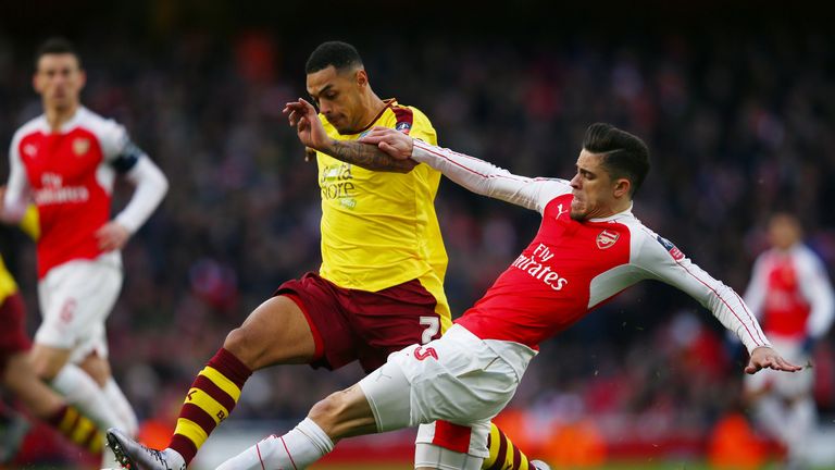 Andre Gray and Gabriel compete for the ball