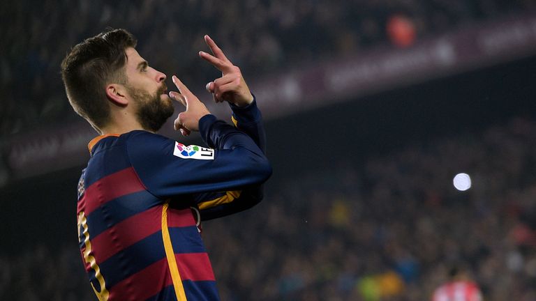 Gerard Pique celebrates after putting Barcelona ahead in the second half