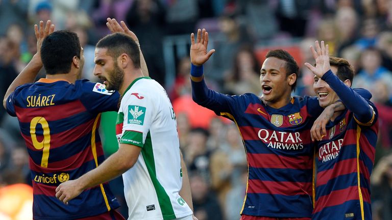 Lionel Messi scored a hat-trick as Barcelona eased past Granada