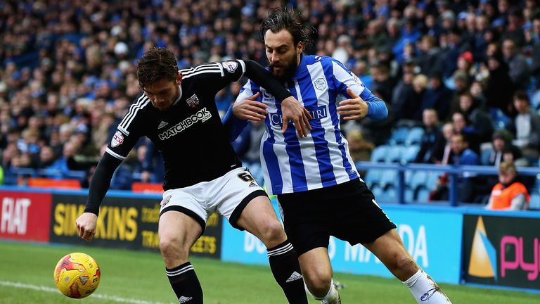 Harlee Dean and Atdhe Nuhiu challenge for the ball at Hillsborough.