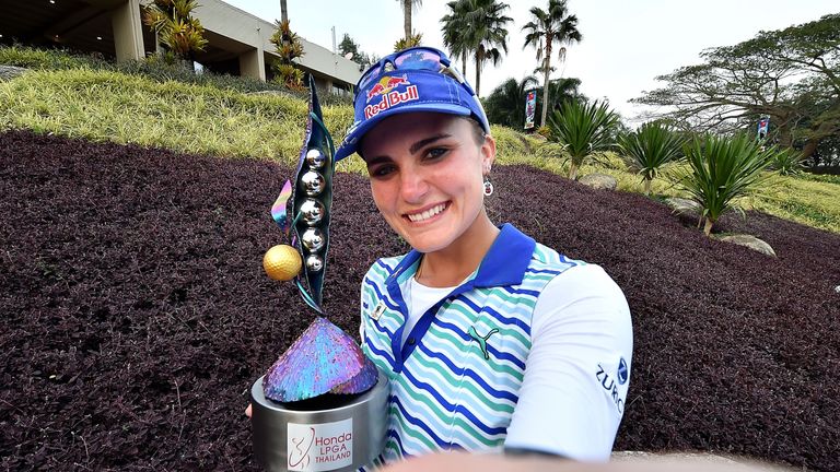 Lexi Thompson holds the trophy after winning the LPGA Thailand
