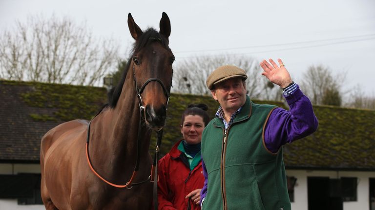 Trainer Nicky Henderson proudly stands with My Tent or Yours