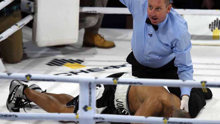 Jones Jr. lies in the ring after being knocked out by Enzo Maccarinelli in December