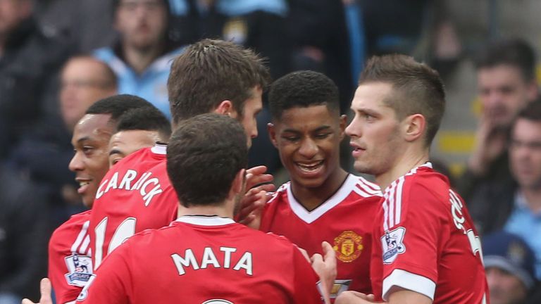 Marcus Rashford celebrates with team-mates after scoring the winner