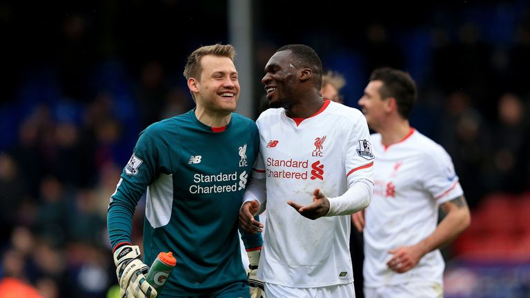 Liverpool goalkeeper Simon Mignolet and Christian Benteke celebrate