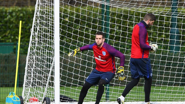 Tom Heaton (left) is put through his paces at England training