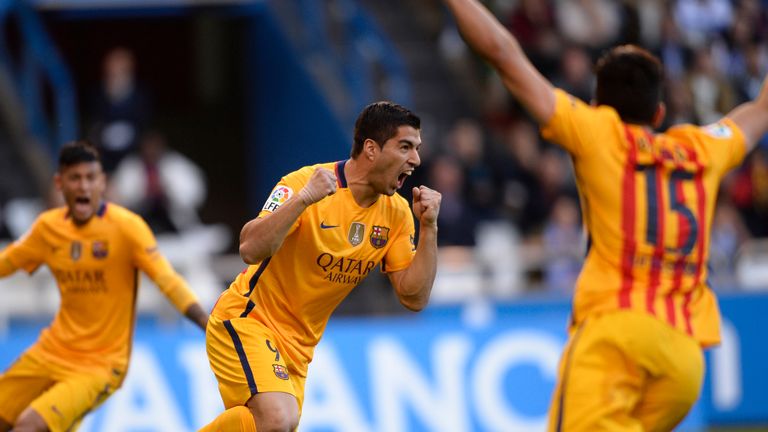 Barcelona's Luis Suarez (C) celebrates after scoring against Deportivo