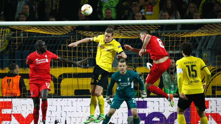 Mamadou Sakho (left) and Dejan Lovren (second right) challenge Sven Bender during Liverpool's 1-1 draw in Dortmund